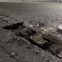 CNAIR, amendată pentru gropile de pe autostradă, care avariază mașinile. Amenda, ridicol de mică