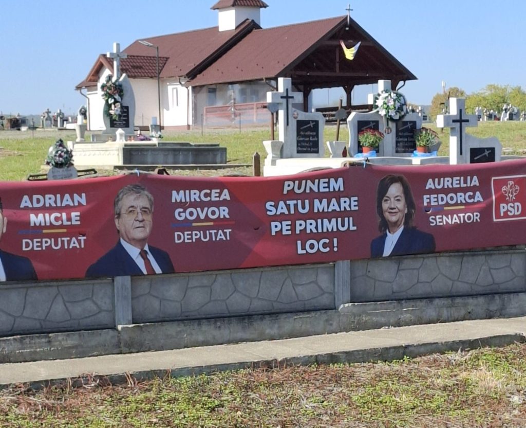 PSD, campanie electorală pe gardul cimitirului